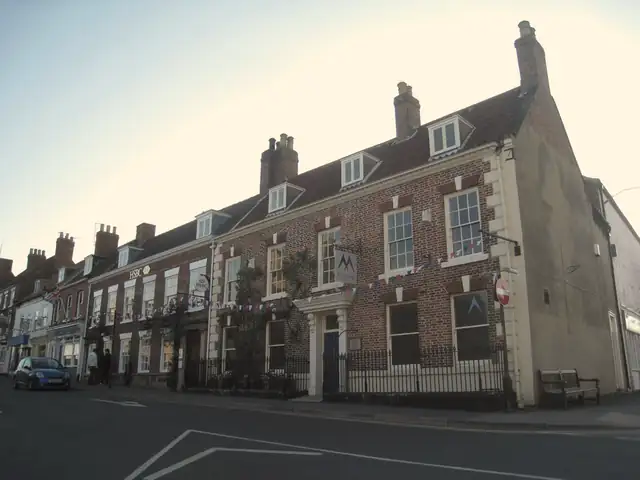 Eighteenth-century brick houses on Market Place, Malton, with dormer windows, tall chimneys and steep roofs