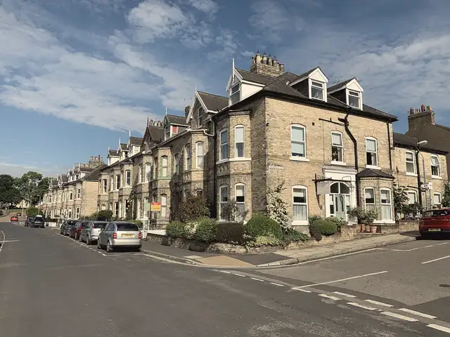 Terrace of Victorian bay-fronted villas with slate roofs, dormers and chimneys on Southlands Road, York